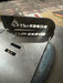 TheBBQHQ black metal grill sign with flame logo and white lettering on table