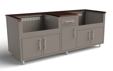 Gray outdoor kitchen module with dark wood top, four cabinets, center drawer, and ventilation ports