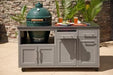 Two-piece coastal gray outdoor kitchen island with Big Green Egg base, stainless countertop, and cabinet storage